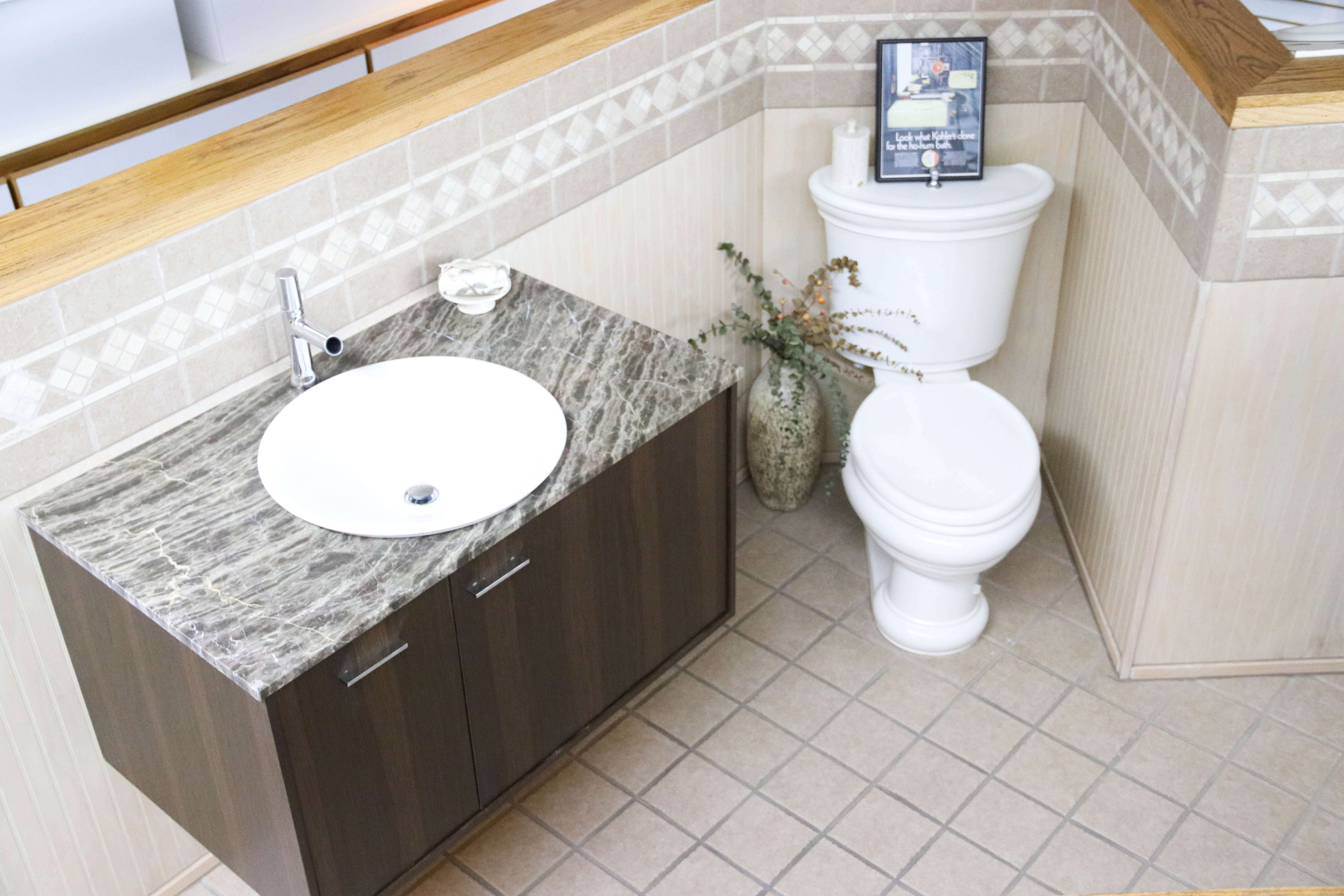 Modern bathroom vanity and toilet.